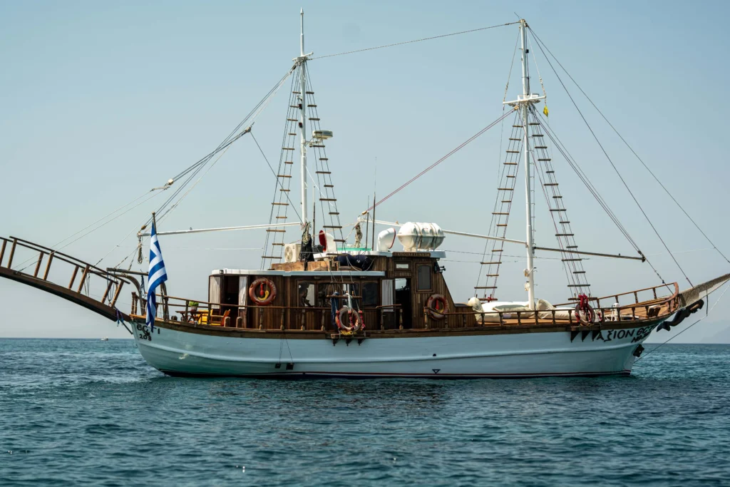 Athens Riviera sunset cruise with golden light over the Saronic Gulf